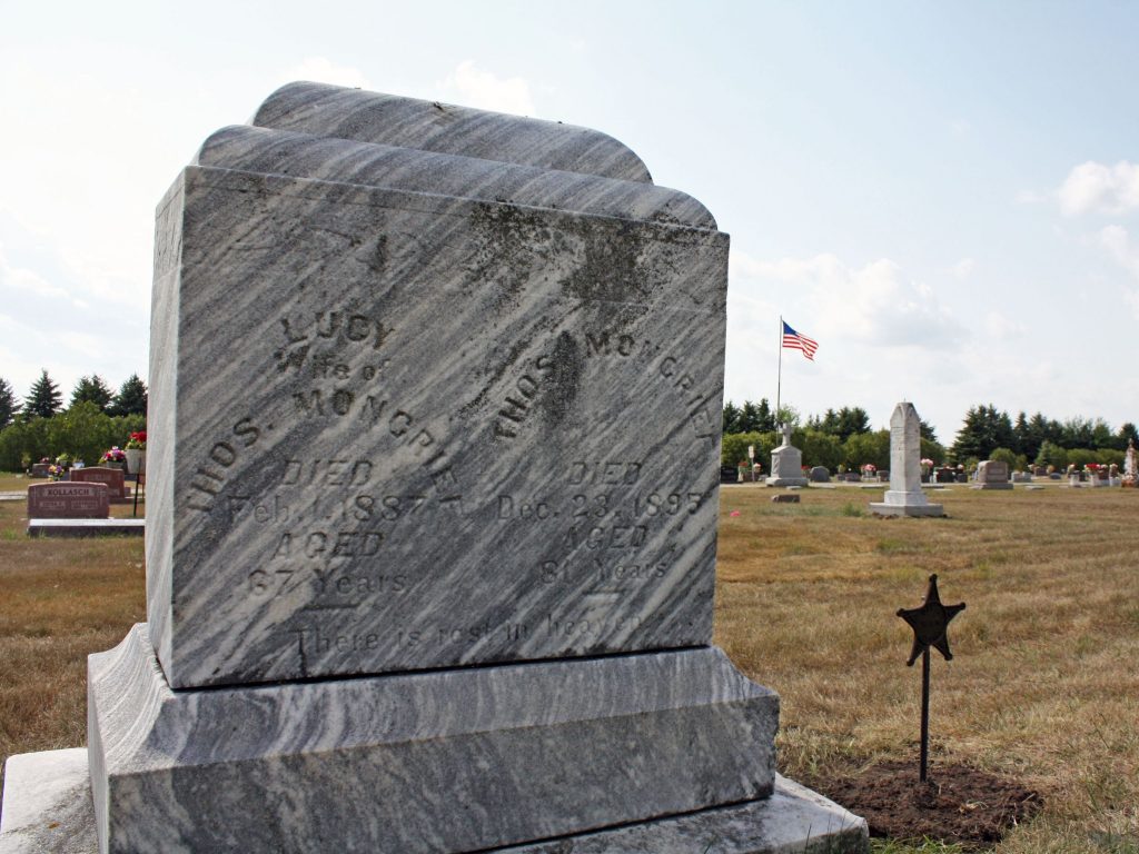 The tombstone of Thomas and Lucy Moncrief in Emmetsburg, Iowa